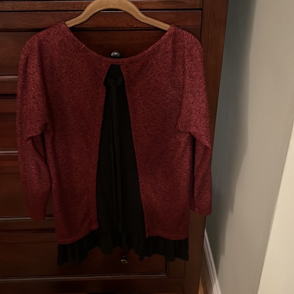 Red tunic with black ruffle details at the bottom. Black insert ribbon at back. - Picture 2 of 3